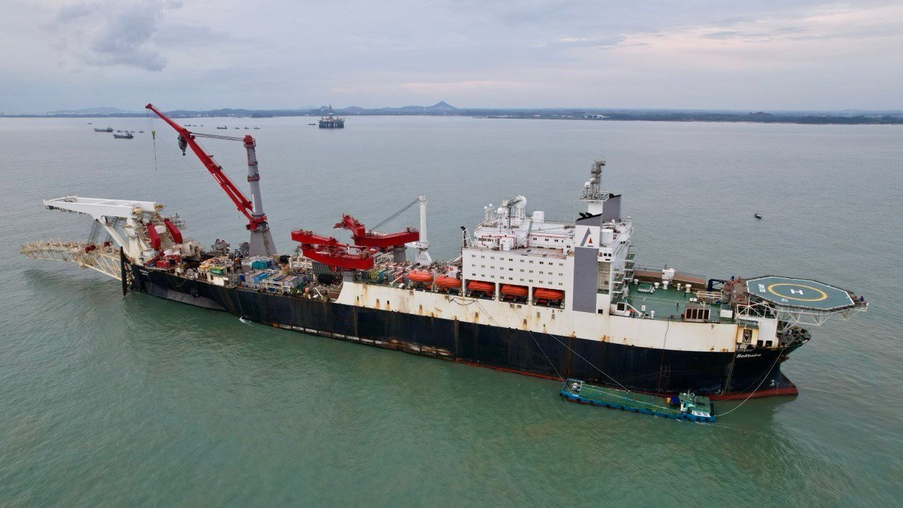 Fresh water barge supplying a commercial ship in Oman